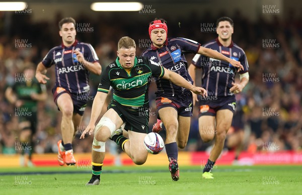 240525 - Northampton Saints v Union Bordeaux-Begles, EPCR Champions Cup Final - Tom Litchfield of Northampton Saints beats Louis Bielle-Biarrey of Union Bordeaux-Begles to the ball