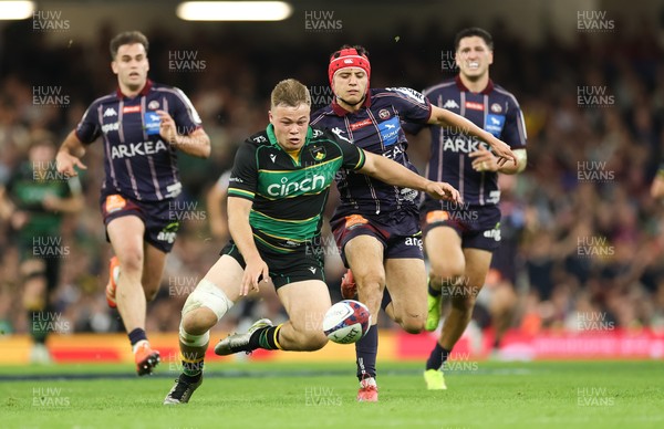 240525 - Northampton Saints v Union Bordeaux-Begles, EPCR Champions Cup Final - Tom Litchfield of Northampton Saints beats Louis Bielle-Biarrey of Union Bordeaux-Begles to the ball