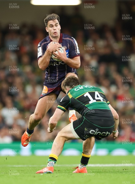 240525 - Northampton Saints v Union Bordeaux-Begles, EPCR Champions Cup Final - Damian Penaud of Union Bordeaux-Begles takes the ball as Tommy Freeman of Northampton Saints closes in