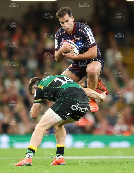 240525 - Northampton Saints v Union Bordeaux-Begles, EPCR Champions Cup Final - Damian Penaud of Union Bordeaux-Begles takes the ball as Tommy Freeman of Northampton Saints closes in