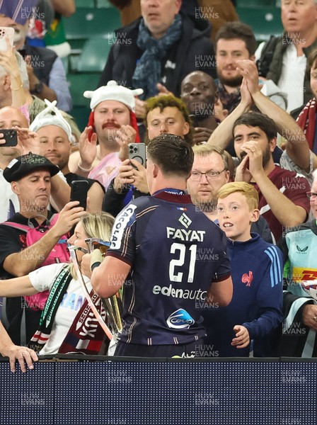 240525 - Northampton Saints v Union Bordeaux-Begles, EPCR Champions Cup Final - Marko Gazzotti of Union Bordeaux-Begles lifts the trophy as he celebrates with fans