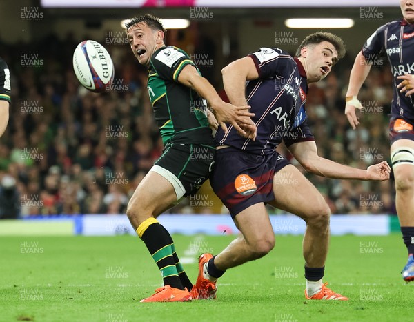 240525 - Northampton Saints v Union Bordeaux-Begles, EPCR Champions Cup Final - Alex Mitchell of Northampton Saints and Damian Penaud of Union Bordeaux-Begles compete for the ball