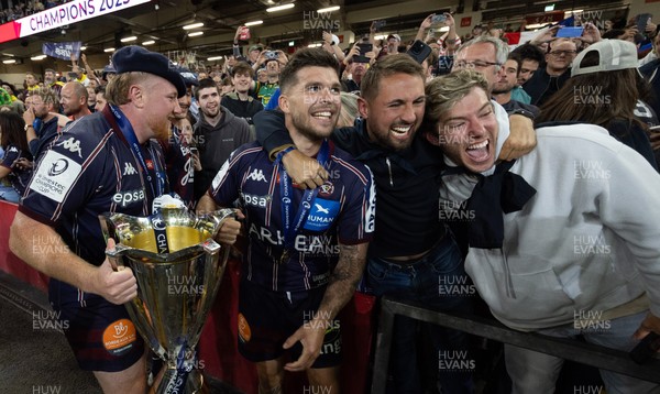 240525 - Northampton Saints v Union Bordeaux-Begles, EPCR Champions Cup Final - Union Bordeaux-Begles players celebrate with the trophy and fans