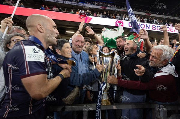 240525 - Northampton Saints v Union Bordeaux-Begles, EPCR Champions Cup Final - Maxime Lucu of Union Bordeaux-Begles celebrates with the trophy and fans