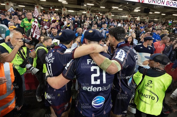 240525 - Northampton Saints v Union Bordeaux-Begles, EPCR Champions Cup Final - Union Bordeaux-Begles players celebrate with the trophy and fans