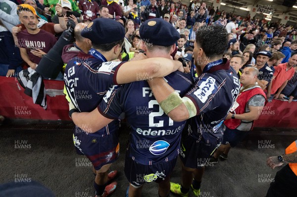 240525 - Northampton Saints v Union Bordeaux-Begles, EPCR Champions Cup Final - Union Bordeaux-Begles players celebrate with the trophy and fans