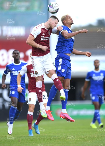 050920 - Northampton Town v Cardiff City - Carabao Cup First Round South - Fraser Horsfall of Northampton Town and Robert Glatzel of Cardiff City compete in the air