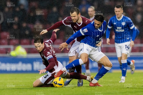 221125 - Northampton Town v Cardiff City - Sky Bet League 1 - Yousef Salech of Cardiff City wins the ball from Terry Taylor of Northampton Town and Jack Burroughs of Northampton Town