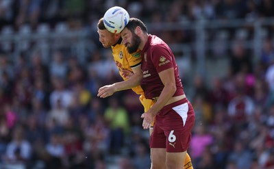 050926 - Northampton Town v Newport County, EFL Sky Bet League 2 - Elliott Moore of Northampton Town and Lee Jenkins of Newport County compete for the ball
