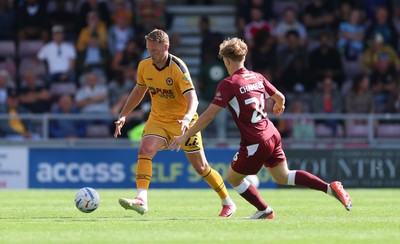 050926 - Northampton Town v Newport County, EFL Sky Bet League 2 - Cameron Norman of Newport County takes on Sam Chambers of Northampton Town