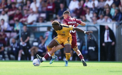 050926 - Northampton Town v Newport County, EFL Sky Bet League 2 - Shaquille Gwengwe of Newport County is challenged by Joe Wormleighton of Northampton Town