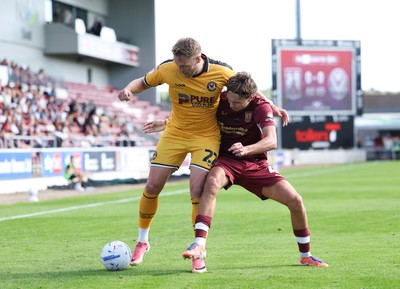 050926 - Northampton Town v Newport County, EFL Sky Bet League 2 - Cameron Norman of Newport County holds off Joseph O'Brien-Whitmarsh of Northampton Town