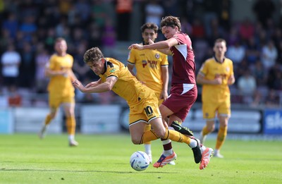 050926 - Northampton Town v Newport County, EFL Sky Bet League 2 - Harrison Biggins of Newport County is brought down by Joseph O'Brien-Whitmarsh of Northampton Town