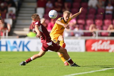 050926 - Northampton Town v Newport County, EFL Sky Bet League 2 - Matty Jacob of Newport County plays the ball past Joe Wormleighton of Northampton Town
