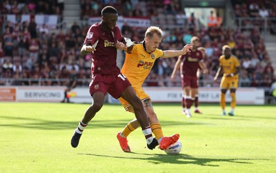 050926 - Northampton Town v Newport County, EFL Sky Bet League 2 - Tyrese Fornah of Northampton Town and Matty Jacob of Newport County compete for the ball