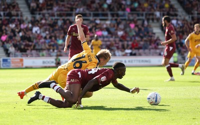 050926 - Northampton Town v Newport County, EFL Sky Bet League 2 - Tyrese Fornah of Northampton Town and Matty Jacob of Newport County compete for the ball