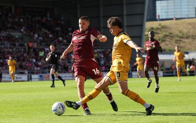 050926 - Northampton Town v Newport County, EFL Sky Bet League 2 - Harrison Biggins of Newport County is challenged by Joe Wormleighton of Northampton Town