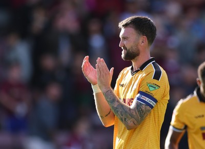 050926 - Northampton Town v Newport County, EFL Sky Bet League 2 - Kyle Cameron of Newport County applauds the fans at the end of the match