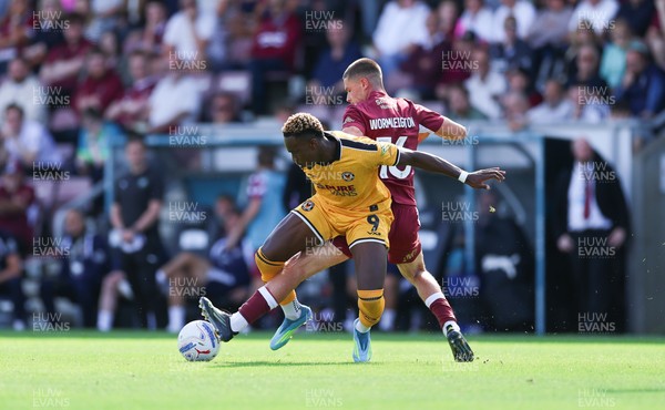 050926 - Northampton Town v Newport County, EFL Sky Bet League 2 - Shaquille Gwengwe of Newport County is challenged by Joe Wormleighton of Northampton Town