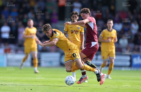 050926 - Northampton Town v Newport County, EFL Sky Bet League 2 - Harrison Biggins of Newport County is brought down by Joseph O'Brien-Whitmarsh of Northampton Town