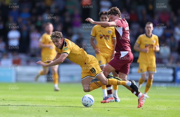 050926 - Northampton Town v Newport County, EFL Sky Bet League 2 - Harrison Biggins of Newport County is brought down by Joseph O'Brien-Whitmarsh of Northampton Town