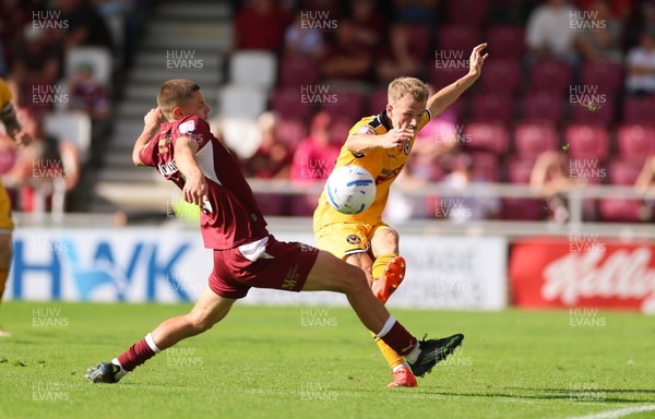 050926 - Northampton Town v Newport County, EFL Sky Bet League 2 - Matty Jacob of Newport County plays the ball past Joe Wormleighton of Northampton Town