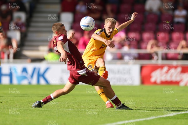 050926 - Northampton Town v Newport County, EFL Sky Bet League 2 - Matty Jacob of Newport County plays the ball past Joe Wormleighton of Northampton Town