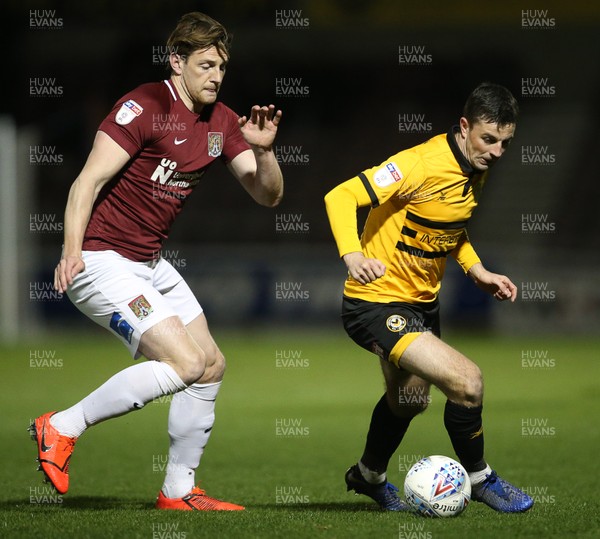 120319 - Northampton Town v Newport County - SkyBet League Two - Padraig Amond of Newport County is challenged by Ash Taylor of Northampton