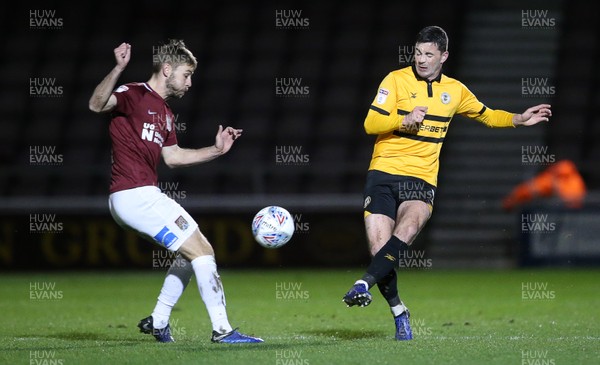 120319 - Northampton Town v Newport County - SkyBet League Two - Padraig Amond of Newport County is tackled by Sam Foley of Northampton