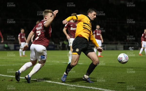 120319 - Northampton Town v Newport County - SkyBet League Two - Padraig Amond of Newport County is challenged by Sam Hoskins of Northampton