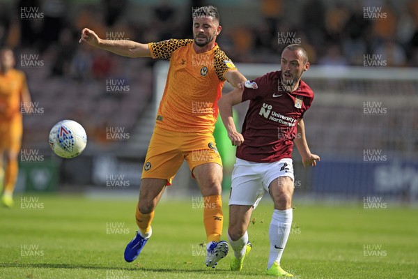 140919 - Northampton Town v Newport County, Sky Bet League 2 - Padraig Amond of Newport County (left) in action with Michael Harriman of Northampton Town