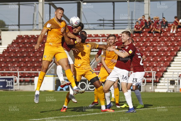 140919 - Northampton Town v Newport County, Sky Bet League 2 - Kyle Howkins of Newport County (left) heads at goal