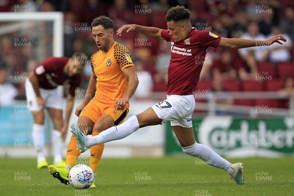 140919 - Northampton Town v Newport County, Sky Bet League 2 - Robbie Willmott of Newport County (left) and Shaun McWilliams of Northampton Town battle for the ball