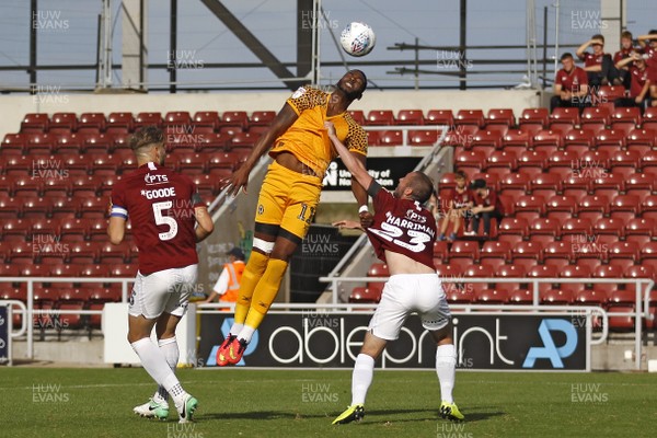 140919 - Northampton Town v Newport County, Sky Bet League 2 - Jamille Matt of Newport County (centre) attempts to head the ball