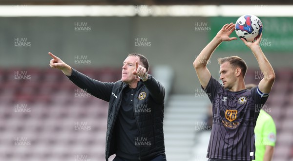 291022 - Northampton Town v Newport County - Sky Bet League 2 - Manager Graham Coughlan of Newport County delays throw in by Mickey Demetriou of Newport County as he gestures to players