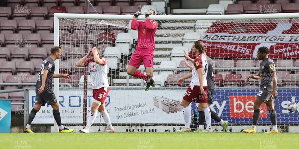 291022 - Northampton Town v Newport County - Sky Bet League 2 - Goalkeeper Joe Day of Newport County swings from the crossbar after saving a shot from Aaron Magloire of Northampton Town in 1st half