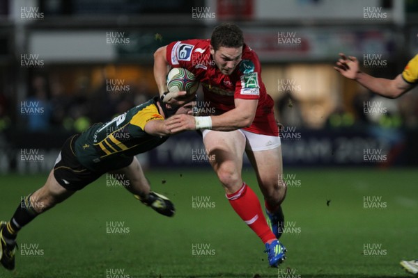 18.11.11 - Northampton Saints v Scarlets - Heineken Cup Scarlets' George North slips a tackle 