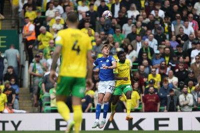 030525 - Norwich City v Cardiff City - Sky Bet Championship - Joel Bagan of Cardiff City and Forson Amankwah of Norwich City challenge for a header