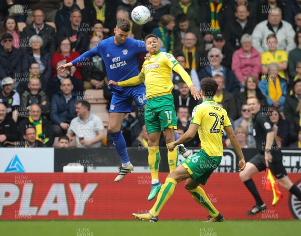 140418 - Norwich City v Cardiff City, Sky Bet Championship - Gary Madine of Cardiff City and Josh Murphy of Norwich City compete for the ball