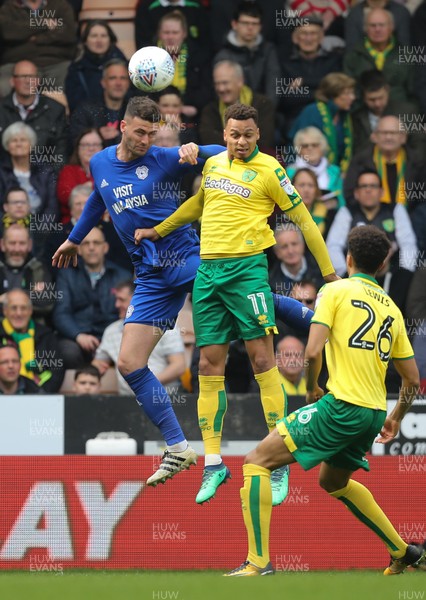 140418 - Norwich City v Cardiff City, Sky Bet Championship - Gary Madine of Cardiff City and Josh Murphy of Norwich City compete for the ball