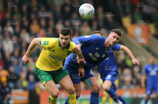 140418 - Norwich City v Cardiff City, Sky Bet Championship - Gary Madine of Cardiff City and Grant Hanley of Norwich City look to win the ball