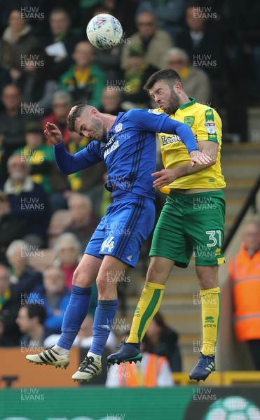 140418 - Norwich City v Cardiff City, Sky Bet Championship - Gary Madine of Cardiff City and Grant Hanley of Norwich City compete for the ball