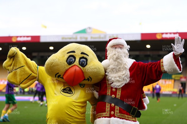 191220 - Norwich City v Cardiff City - Sky Bet Championship - Norwich City mascot, Captain Canary is seen with Father Christmas ahead of the match