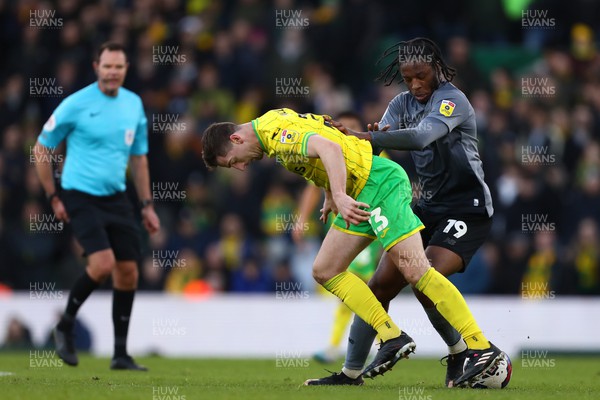 250223 - Norwich City v Cardiff City - Sky Bet Championship - Romaine Sawyers of Cardiff City and Kenny McLean of Norwich City