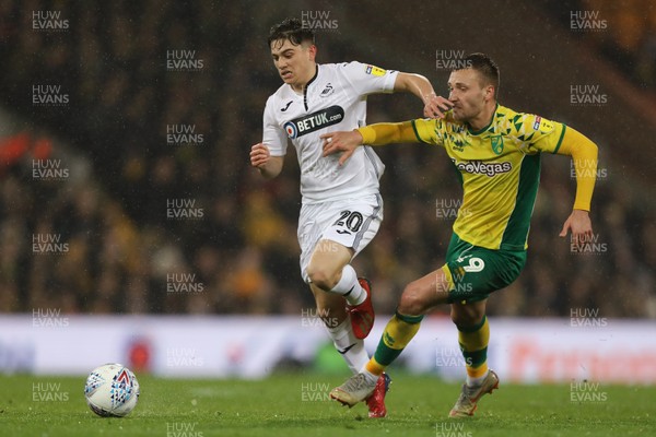 080319 - Norwich City v Swansea City - Sky Bet Championship -  Daniel James of Swansea City battles with Tom Trybull of Norwich City 