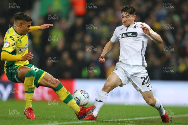 080319 - Norwich City v Swansea City - Sky Bet Championship -  Daniel James of Swansea City and Max Aarons of Norwich City 