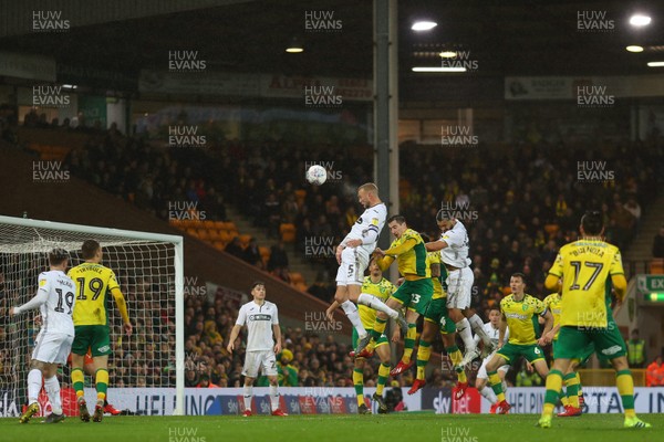 080319 - Norwich City v Swansea City - Sky Bet Championship -  Mike van der Hoorn of Swansea City attempts to direct a headed effort at goal but goes high over the bar 