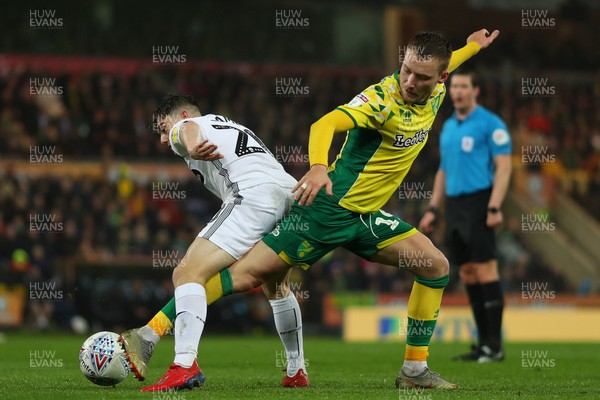 080319 - Norwich City v Swansea City - Sky Bet Championship -  Daniel James of Swansea City and Tom Trybull of Norwich City battle for possession 