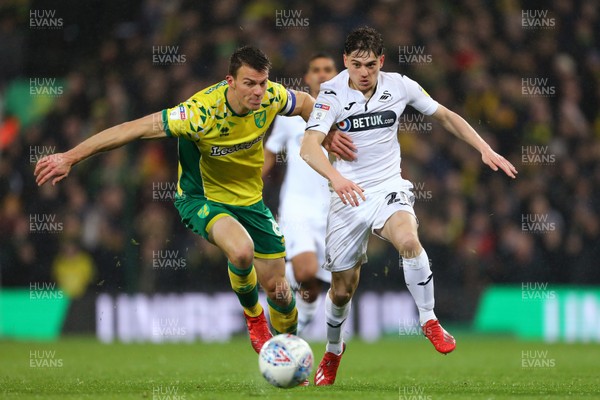 080319 - Norwich City v Swansea City - Sky Bet Championship -  Daniel James of Swansea City battles with Christoph Zimmermann of Norwich City 