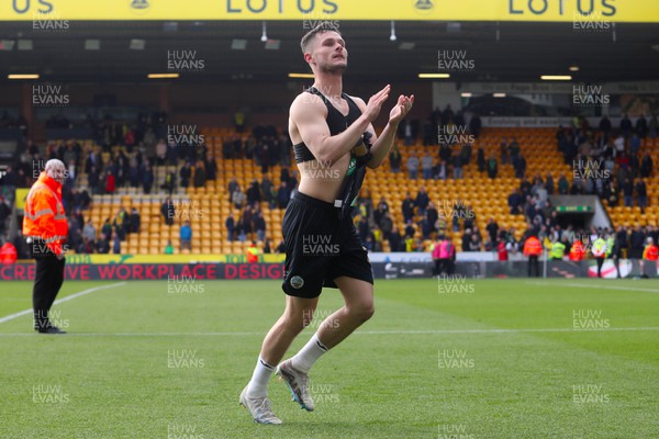 220423 - Norwich City v Swansea City - Sky Bet Championship - Liam Cullen of Swansea City takes his shirt off and applauds the fans after Swansea City win the game